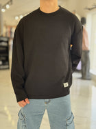 Buzo oversize tejido negro