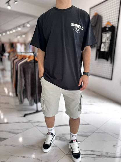 Remera oversize negra “unreal”